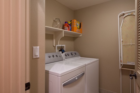 - Full laundry room with washer, dryer, and storage shelf keeps your beachwear fresh all trip long - Stocked with detergent and essentials for your convenience - Located just off the hallway for easy mid stay laundry or long term visits