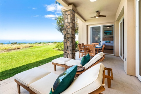 - Cushioned loungers and tropical accent pillows facing sweeping ocean views - Stone pillar design and ceiling fan provide shade and comfort for outdoor relaxation - Adjacent dining area creates the perfect blend of lounging and al fresco dining spaces