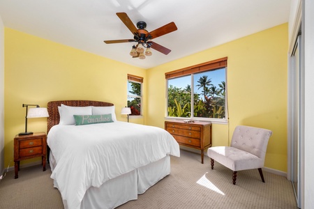 Wake up to palm trees and sunshine in this bright bedroom retreat.