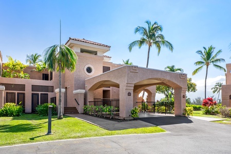 Elegant tropical villa surrounded by swaying palms and vibrant landscaping