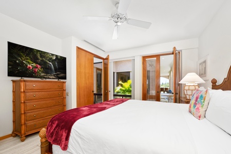 - Enjoy entertainment in bed with a flat screen TV and beautiful outdoor views beyond - Glass doors bring in natural light and open to a breezy garden setting - Room includes plenty of drawer space and inviting tropical accents throughout