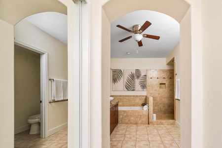 Primary bathroom with double vanity, walk-in shower, and soaking tub