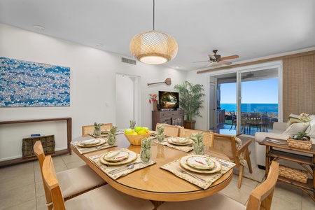 Your elegant dining space flows into the living room, with stunning ocean views beyond your private balcony creating the perfect backdrop for memorable meals.