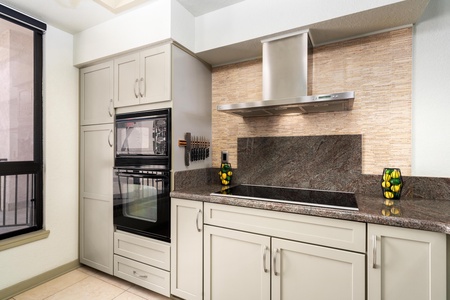 Full kitchen with modern appliances and granite countertops