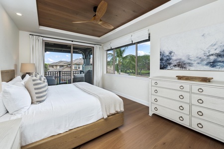 Drift off to sleep in this serene bedroom where tropical breezes flow through your private balcony doors and natural wood touches create warmth.