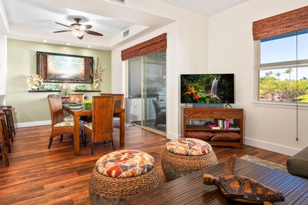 Open concept layout connects living room, dining, and kitchen