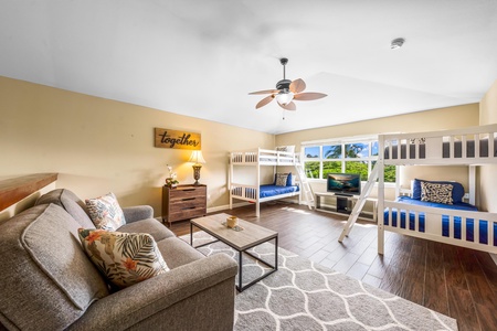 Loft with two twin bunk beds seating area