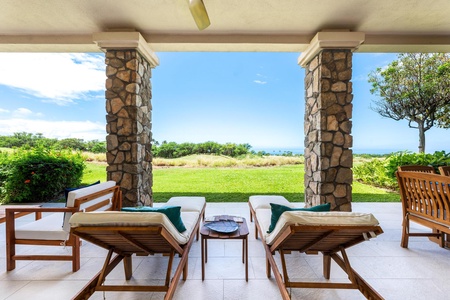 - Relax on cushioned loungers under a shaded patio with rustic stone pillars framing the view - Gaze across the lawn stretching to the sparkling ocean horizon - Perfect spot for morning coffee or evening sunsets in a serene setting