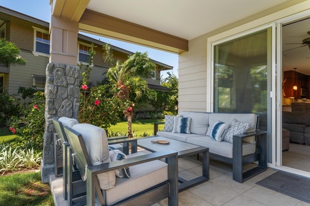 Relax in your private covered patio overlooking lush tropical gardens. Sink into plush outdoor seating surrounded by vibrant blooms and swaying palms—your perfect retreat for morning coffee or evening unwinding.