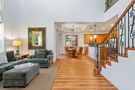 Open concept space connects living room, dining area, and kitchen beautifully.