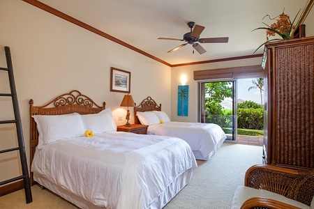 - Bright guest bedroom with two plush queen beds dressed in crisp white linens   - Ceiling fan, warm wood accents, and sliding doors open to a tropical view   - Elegant touches like fresh flowers create a welcoming retreat for relaxation
