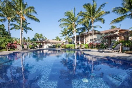 Resort style pool glistening under clear Hawaiian skies.