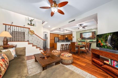 Open concept layout connects living room, dining, and kitchen