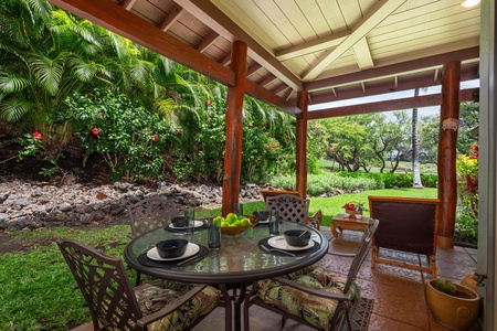 - Covered lanai with dining table and cushioned chairs for four guests - Scenic garden views and beautiful tropical landscaping enhance the space - Perfect for casual meals, morning coffee, or evening gatherings