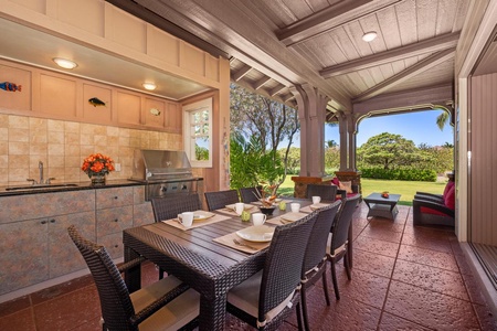 - Host tropical meals at this outdoor dining table with seating for eight guests - Full built in grill setup makes BBQ nights easy and enjoyable for all - Surrounded by greenery and open skies for a truly island style dinner