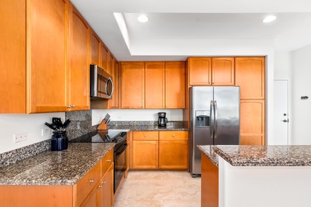 Plenty of storage and granite surfaces create a functional kitchen.