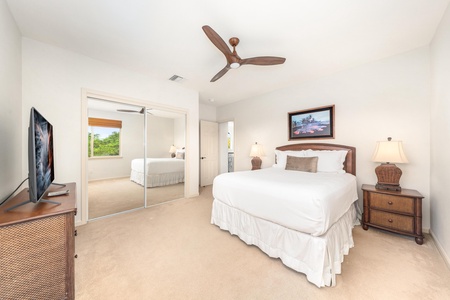 Your spacious bedroom suite features crisp linens, tropical decor, and a ceiling fan to keep you cool while you rest.