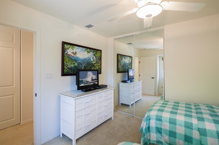 - Twin bedroom includes a large dresser, tropical art, and a flat screen TV for relaxed downtime - Mirrored closet doors help the room feel even more spacious and bright - Ceiling fan keeps cool air circulating for restful, comfortable sleep