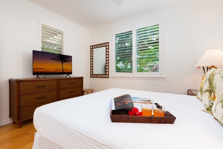 - Cozy queen room with flat screen TV and dresser for added convenience - Shuttered windows frame beautiful greenery just outside the window - Breakfast tray with fresh touches sets the tone for restful mornings
