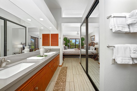 - Ensuite bathroom opens directly into the serene king bedroom, combining convenience and style - Glass panels and clean tilework reflect the natural light from both rooms - Spacious layout and thoughtful design make mornings feel easy and indulgent