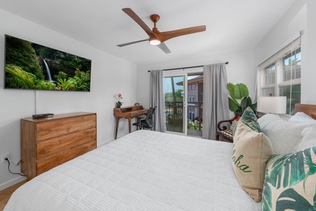 Primary bedroom includes a wall mounted TV, ceiling fan, and lanai access.