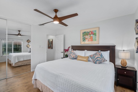 Peaceful bedroom with soft white bedding.