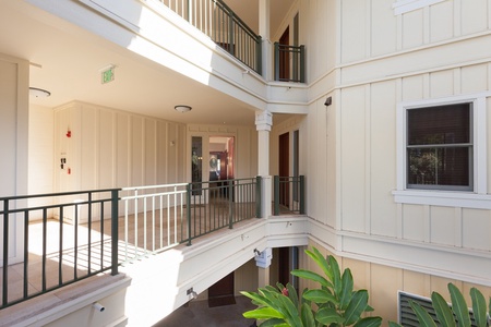 Interior courtyard with open walkways and railings.