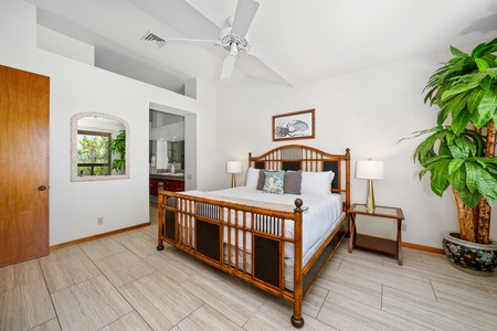 - Restful and refined, this bedroom offers a comfortable king bed with plush linens and soft lighting - Matching nightstands and wood headboard add a warm, natural touch - Open doorway leads to the ensuite bathroom for added privacy and ease