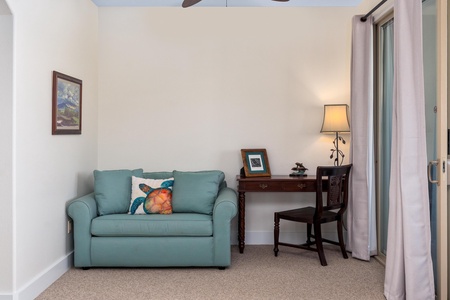 Primary suite with king bed and lounge area