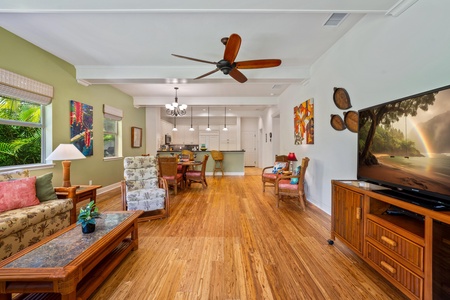 Open concept layout connects living room, dining, and kitchen