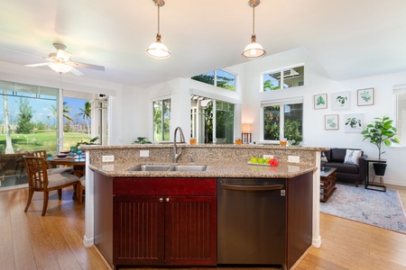 - Prep meals with ease at this granite island featuring a deep sink and modern dishwasher - Pendant lighting illuminates the open layout with style and function - Overlooks the dining and living space keeping everything connected