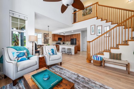 Bright, spacious living room with vaulted ceiling and tall windows