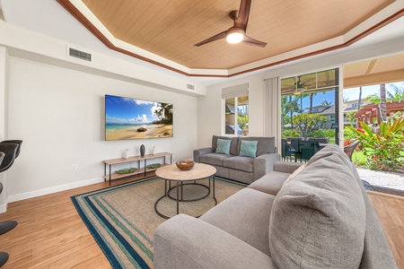 Unwind in your sophisticated living space with plush seating, tropical views, and modern amenities for the perfect island retreat.