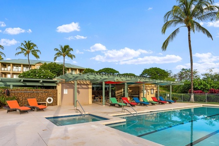Pool and hot tub area offering relaxation under tropical skies.