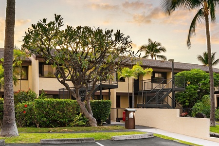Sunset view of building and parking.