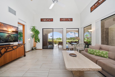 - Indoor outdoor living is effortless with wide sliding glass doors leading to beautiful greenery - Comfortable sectional and earthy tones reflect the surrounding tropical beauty - Perfect space to unwind with morning coffee or evening cocktails