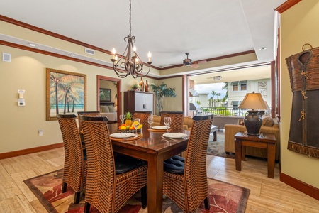 Gather around the elegant dining table, where warm tropical touches and open views create the perfect setting for your island meals together.