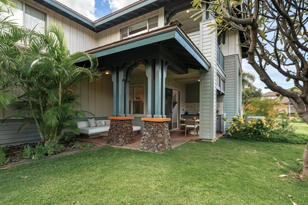 Relax on your private covered patio with comfortable seating, surrounded by lush tropical gardens and perfectly manicured lawn.
