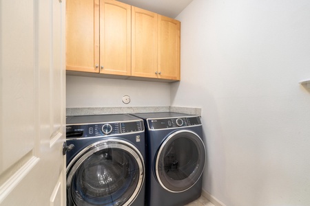 Your dedicated laundry room features high-end washer and dryer with ample cabinet storage for all your vacation needs.