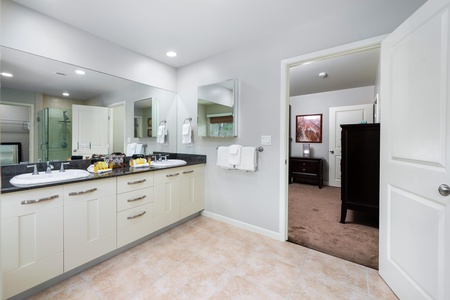 - Dual sinks with plenty of drawer space create a perfect setup for couples or groups - Large mirror, bright lighting, and fluffy towels offer comfort and convenience - Just steps from the primary bedroom for effortless daily routines