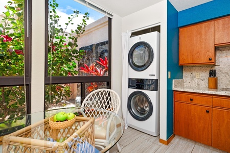 - In unit washer and dryer tucked conveniently beside a cheerful breakfast nook - Floor to ceiling windows flood the space with natural light and garden views - Handle laundry with ease while enjoying snacks, coffee, or good conversation