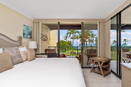 - Wake up to paradise with palm trees and ocean glimpses right outside your door - Large sliding glass doors fill the room with light and fresh island air - Comfy bedding and earthy tones create a tranquil retreat from sunrise to sunset