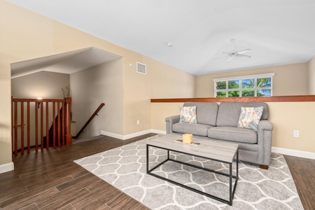 Loft with two twin bunk beds seating area