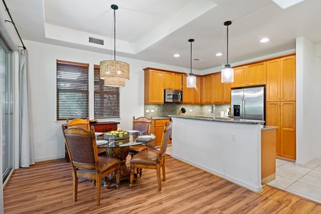 Kitchen and dining space feature granite countertops and plenty of cabinet space.