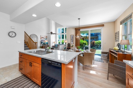 Full kitchen with breakfast bar, granite counters, and modern appliances