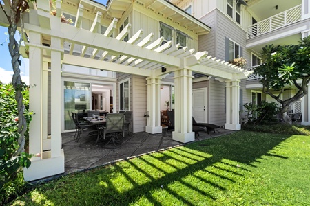 - Outdoor living at its best with a spacious patio framed by elegant white pergola beams - Includes dining area and lounge chairs overlooking beautiful green lawns - Seamlessly extends your living space into the beautiful outdoors