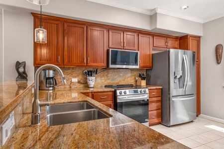 Your gourmet kitchen features granite countertops, rich wood cabinets, and stainless steel appliances for effortless meal preparation.
