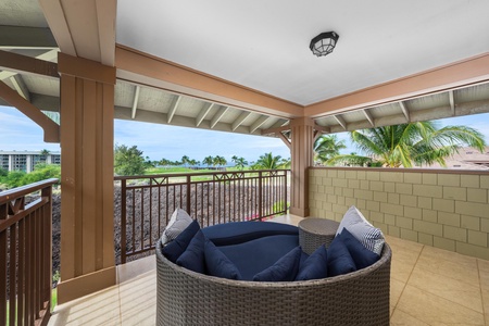 Your private covered terrace offers the perfect spot to unwind with plush seating overlooking tropical views and swaying palms.