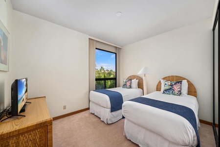 Drift off to tropical dreams in your twin bedroom with rattan headboards and garden views through your private window.