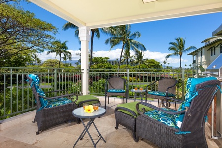 - Spacious balcony with comfortable wicker armchairs and vibrant green cushions   - Surrounded by beautiful tropical landscaping and ocean breezes   - Ideal setting for morning coffee or sunset cocktails with friends